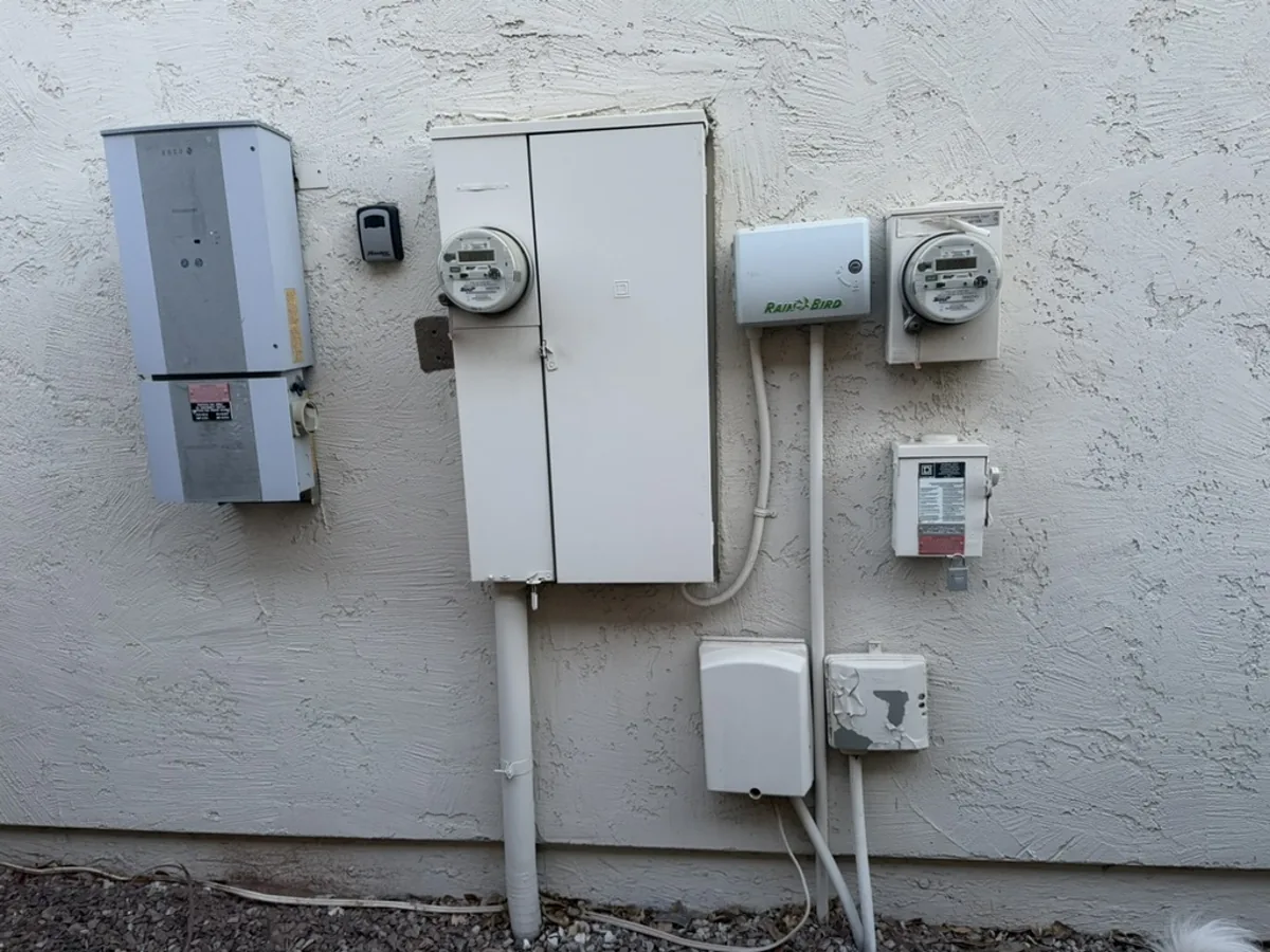 Combination meter-main service equipment being upgraded on a South Orange County stucco home